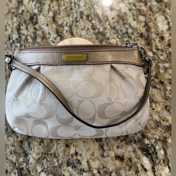 Coach Handbags - Coach Signature Pleated Wristlet in khaki and gold. EUC